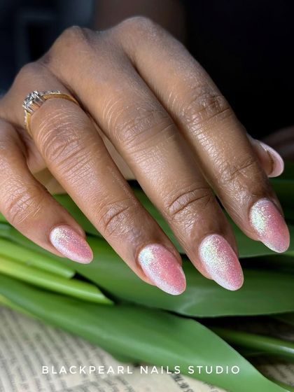 A beautiful set of pink glitter nails that sparkle and shine. This is a perfect choice for weddings, parties, or any time you want to add some extra glam to your look.