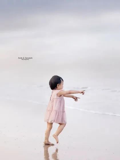 There's something magical about a child's first encounter with the ocean. We captured this beautiful, candid moment of a toddler chasing the waves on a quiet Mumbai beach. These are the dreamy, fleeting memories we feel so privileged to freeze in time.