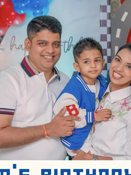 The happy family celebrating their son's racecar-themed birthday. Our greatest joy is creating moments of pure happiness for our clients and their children.