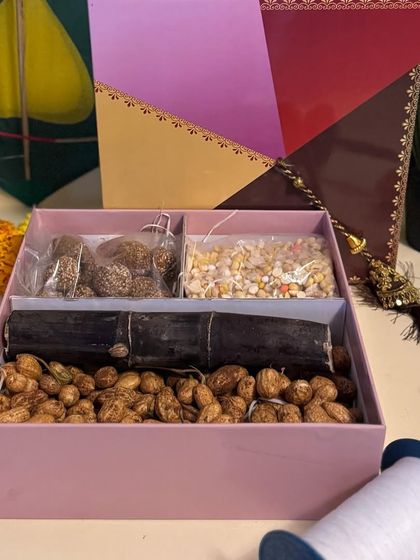 Another view of the open kite-themed box, showcasing the delicious and traditional Sankranti treats ready to be enjoyed.