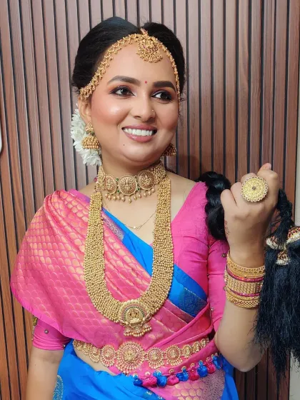 The complete look of a Madisar drape, from the intricate hairstyle and jewelry down to the way the saree is tied. Every detail matters.