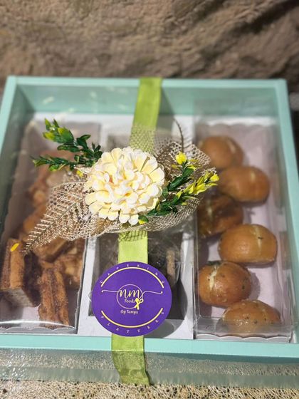 The Savoury and Sweet Box, beautifully packaged and ready for delivery. A perfect gift combining savoury buns with sweet cookies and waffles.