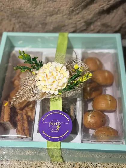 The Savoury and Sweet Box, beautifully packaged and ready for delivery. A perfect gift combining savoury buns with sweet cookies and waffles.