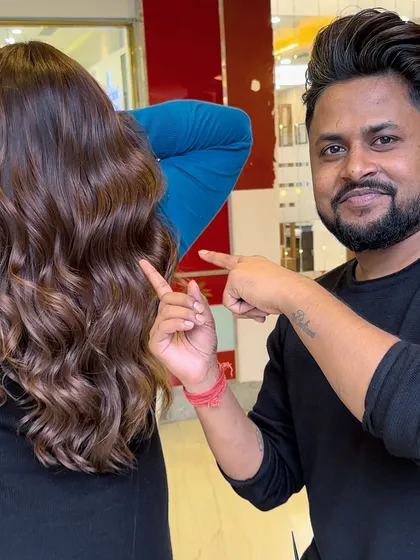Calling all brunettes. This image shows a beautiful rose gold tint on brunette hair, a trendy and unique option.