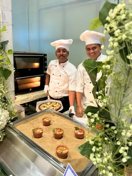 Our chefs, ready to serve fresh, wood-fired pizza from a dedicated live oven station. This popular option brings a casual yet gourmet feel to corporate gatherings and parties.
