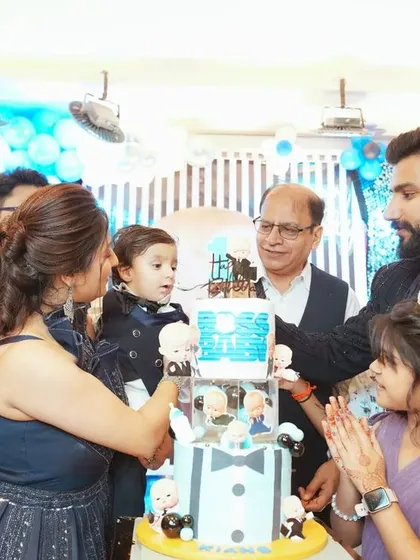 The cake cutting is the heart of the celebration. We make sure to capture this milestone with all the joy and excitement, surrounded by family, as seen here at this Boss Baby themed first birthday party.
