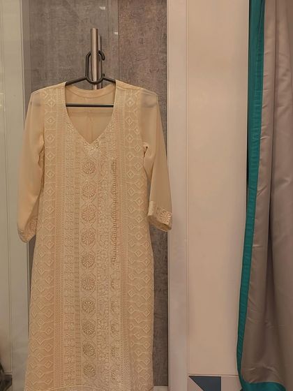 A full view of our classic off-white Chikankari kurta. The detailed hand embroidery covers the front panel, creating a piece that is both traditional and effortlessly stylish.