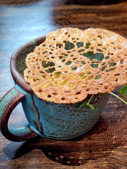 A comforting bowl of Thukpa, the famous North-Eastern noodle soup. We masterfully recreate this dish with its signature spices and broth for an authentic taste of the Himalayas.