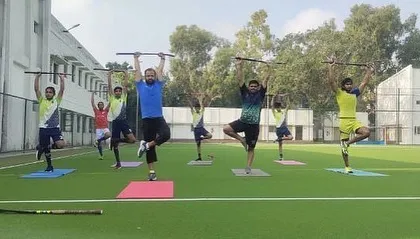 Our training goes beyond the usual drills. I incorporate yoga sessions, using hockey sticks for balance exercises, to improve flexibility, focus, and core strength in my athletes.