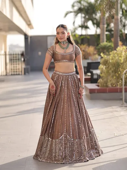 A full view of the Vvani Vats lehenga, showing the beautiful craftsmanship and flattering A-line silhouette. It's a perfect choice for a bride who wants to look graceful and timeless.
