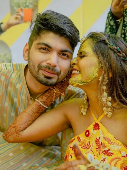 A close-up of the couple sharing an affectionate moment during their Haldi. The love and joy are palpable.
