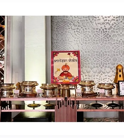 A stylish buffet setup for a "Punjabi Dhaba" themed counter, using modern design elements with a traditional touch.