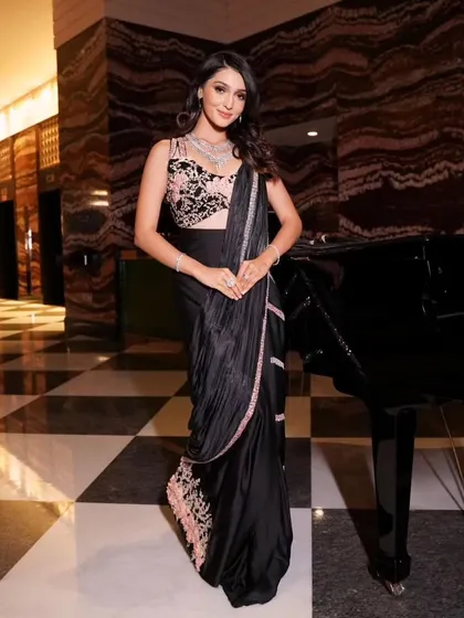 A classic black saree is always a statement. I pre-pleated this satin saree for a sharp, contemporary look, ideal for a sophisticated cocktail event.