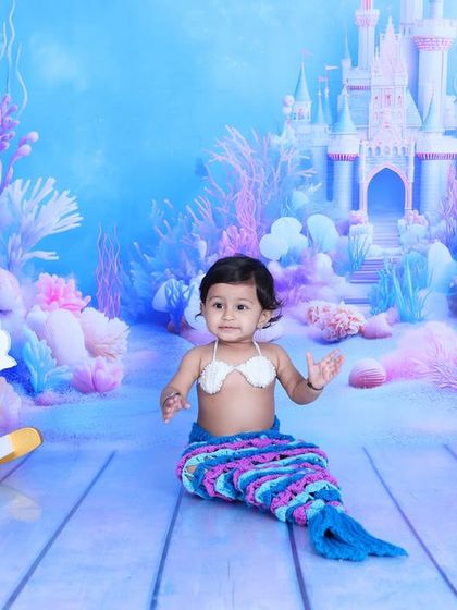 A full view of the enchanting mermaid setup, featuring a baby princess of the sea. The rocking seahorse, unicorn, and underwater castle create a complete fairytale scene.