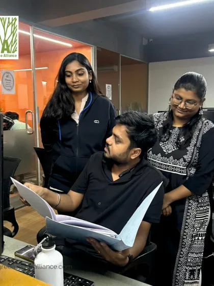 Team members reviewing project documents together. This illustrates our hands-on, collaborative approach, where every detail is discussed and refined to ensure the highest quality outcome.