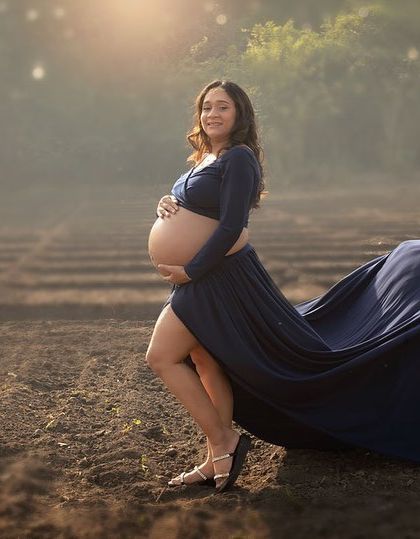 The movement of a flowing gown in an open field adds such a beautiful, dynamic element to a maternity portrait. This shot captures a sense of freedom, beauty, and anticipation.