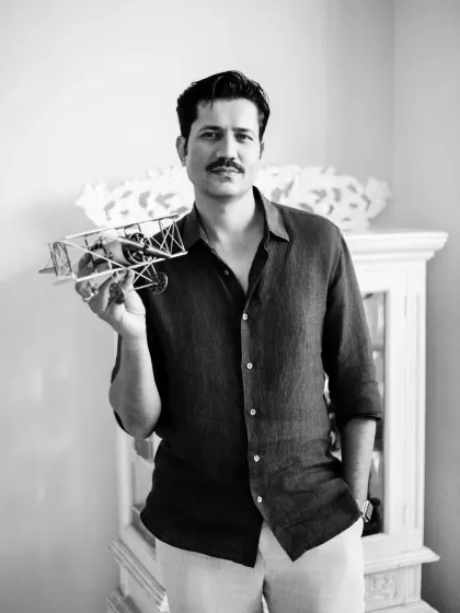 This black and white portrait of Sumeet Vyas holding a model airplane adds a storytelling element to the session. Props can be a great way to reveal more about a subject's personality or interests in their professional headshots.