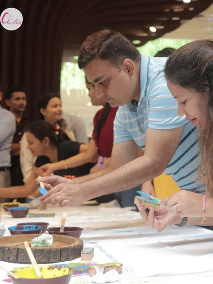 Guests deeply engaged in a block printing workshop. This photo shows the focused and fun atmosphere of our hands-on creative sessions.
