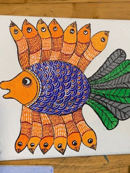 A student's fantastic Gond fish painting on canvas. The intricate patterns and lively colors showcase the imaginative spirit of this art form, which we help our students to channel.