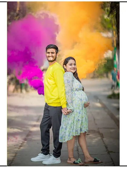 A vibrant gender reveal shot using colored smoke bombs. This is a fantastic way to add excitement and color to your announcement.
