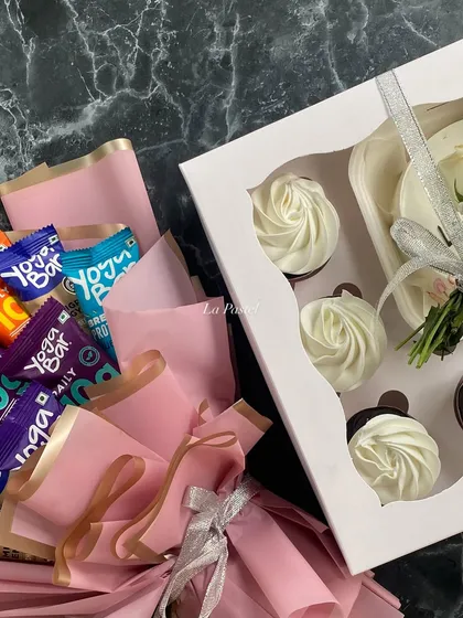A different perspective of the unique "two moods" hamper, highlighting the contrast between indulgent cupcakes and healthy snacks.