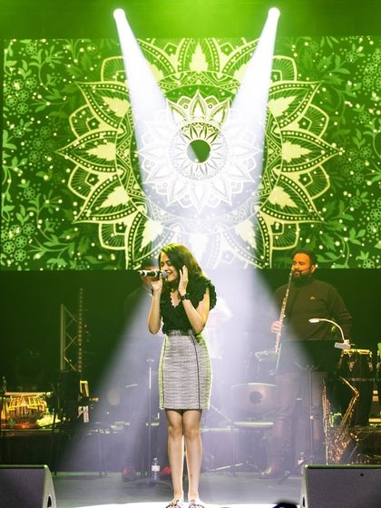 Performing under the lights with my band. We can tailor the setlist and vibe for any large-scale wedding or sangeet.