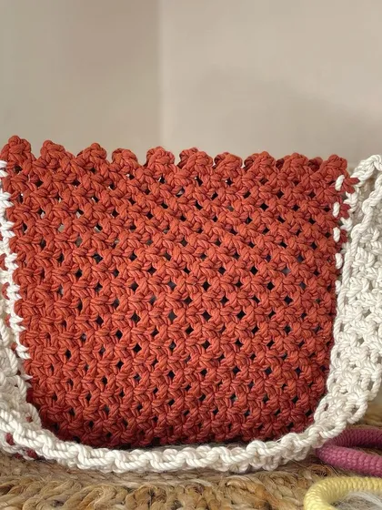 This is one of my bestselling designs, and I can see why. The warm, burnt-orange color is contrasted beautifully with the off-white strap and scalloped edging, creating a perfect boho shoulder bag.