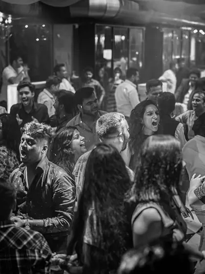 A candid shot of the crowd singing along to a track. These are the moments of connection that make a party special.