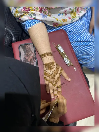 A behind-the-scenes look at a henna application in progress. I am using my signature organic cone to create a beautiful design for a client.