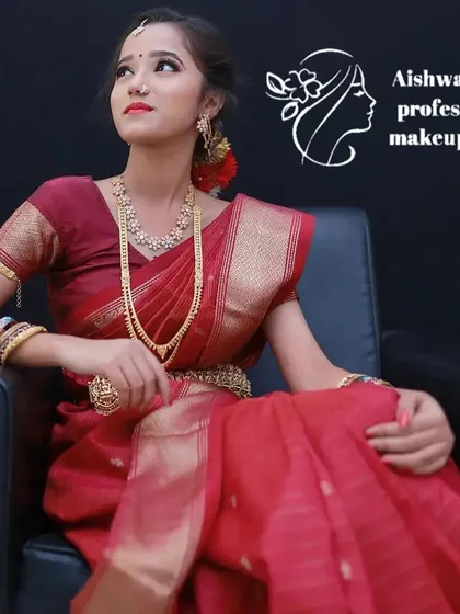 This is a classic festive look, perfect for a sangeet or reception. I styled her in a rich red saree with traditional jewelry, creating a bold red lip and defined eyes to complete the royal look.