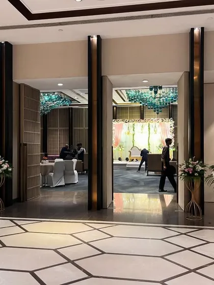 A view from the entrance, giving guests a sneak peek of the stunning stage setup inside. Creating a sense of anticipation is part of the experience.