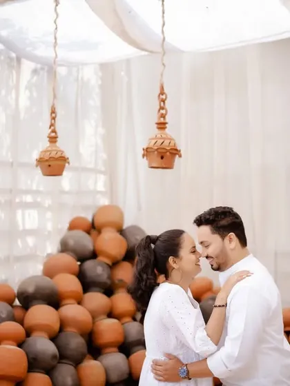 Another angle of the couple's intimate moment, showcasing their connection and the beautiful, rustic ambiance of their pre-wedding shoot.