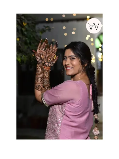 The best part of my job is seeing a happy smile. This lovely bride is showcasing her full bridal henna, and her joy is what makes every minute of my work worthwhile.