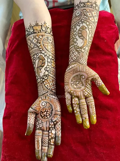 A lovely engagement design featuring parrots and paisleys, a unique take on traditional bird motifs.