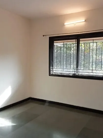 To complete the look, the window frame was also painted in the same matte black, tying all the wooden elements in the room together.