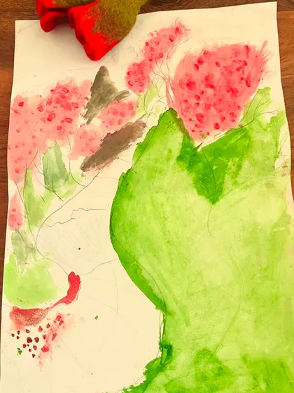 An abstract floral painting in progress. This piece shows a young artist experimenting with watercolor washes and brushstrokes to depict flowers.