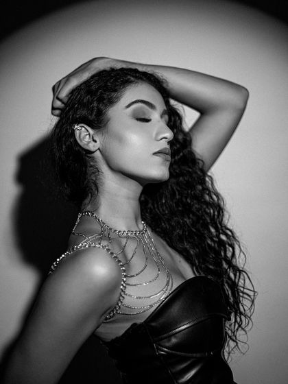 A black and white version of the same look, emphasizing the texture and form of the makeup.