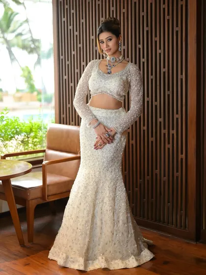 A full view of this stunning cocktail look. The mermaid-style sequined gown is perfectly complemented by the glamorous makeup and a sophisticated updo.