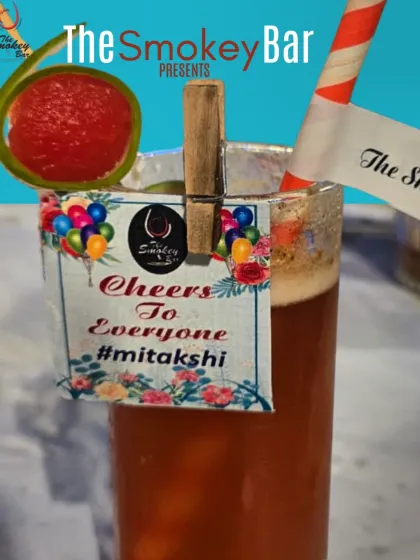 A personalized cocktail created for a special celebration. The drink is garnished with a watermelon ball and a custom tag, showing how I tailor my services for each client.
