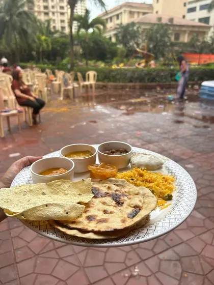 A perfect plate of food at a Holi brunch. This shows a complete meal with roti, rice, multiple curries, and dessert, showcasing the variety I offer.
