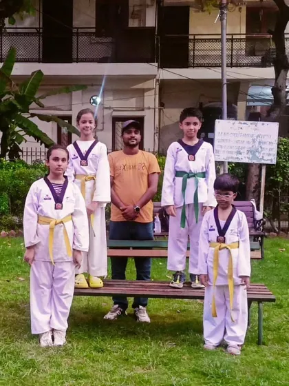 Posing with my students after their successful belt promotion. They have all worked very hard to reach this level.
