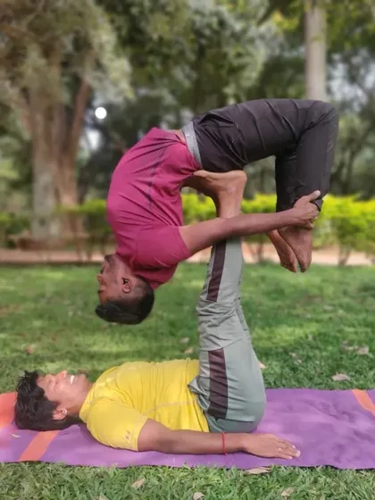 AcroYoga is a practice of trust and letting go. Here, we're exploring an Urdhva Dhanurasana (Upward Bow Pose) variation, relying on balance and communication. It’s a playful way to build strength and connection.