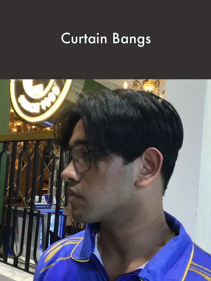 Curtain Bangs are a stylish, softer option for men's hair. This look frames the face and offers a relaxed yet put-together vibe, showcasing my team's ability to handle diverse and trending hairstyles.