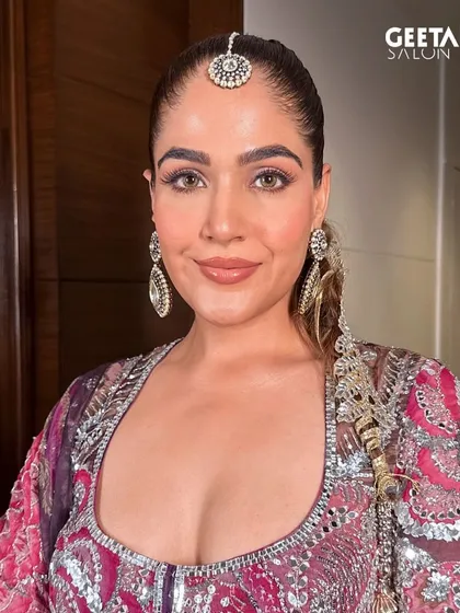 A confident and beautiful bride ready for her big day. Her makeup is flawless from every angle, with a focus on luminous skin and defined eyes, ensuring she is picture-perfect.