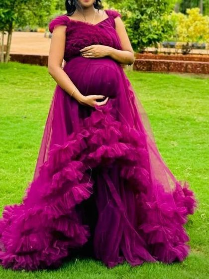 Another look at this stunning magenta ruffle gown, perfect for capturing your pregnancy glow. Ask me about my monsoon offers on all products.