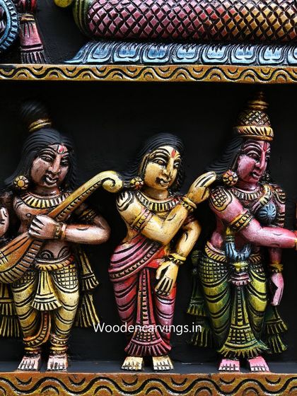 This detail from the Meenakshi panel shows celestial musicians playing their instruments, adding to the celebratory atmosphere of the carving.