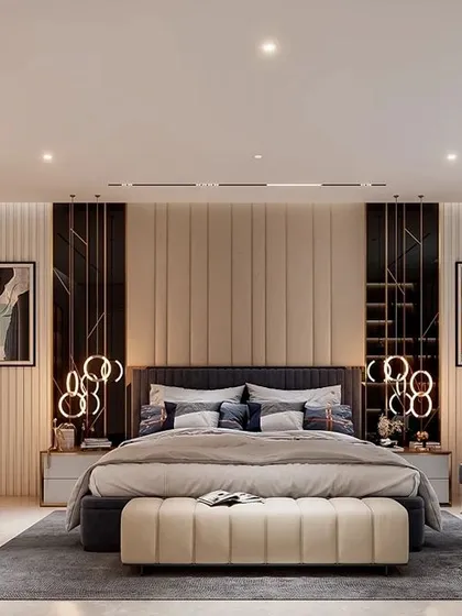 I designed this master bedroom to be a serene and elegant retreat. The floor-to-ceiling upholstered headboard with vertical grooves, flanked by modern art and unique circular pendant lights, adds a layer of sophisticated comfort and luxury.