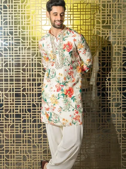 The full look of the floral print kurta, paired with a simple white salwar.
