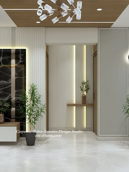 A view of the entryway, where a simple wooden shelf and vertical lighting create a warm and welcoming first impression.
