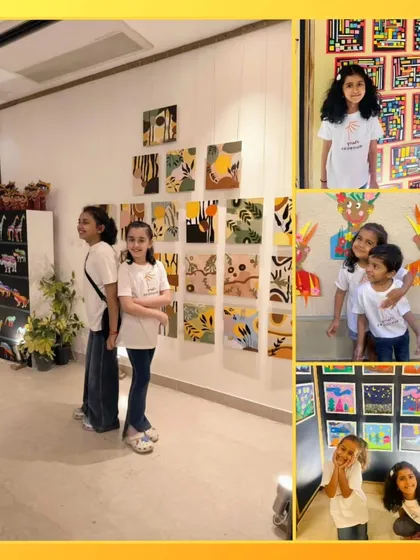 Students posing proudly with their artwork. Seeing their creations displayed so beautifully is a huge confidence booster.
